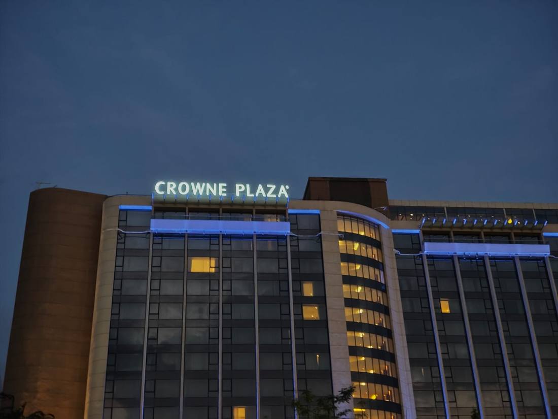 Crowne Plaza illuminated corner letters at night