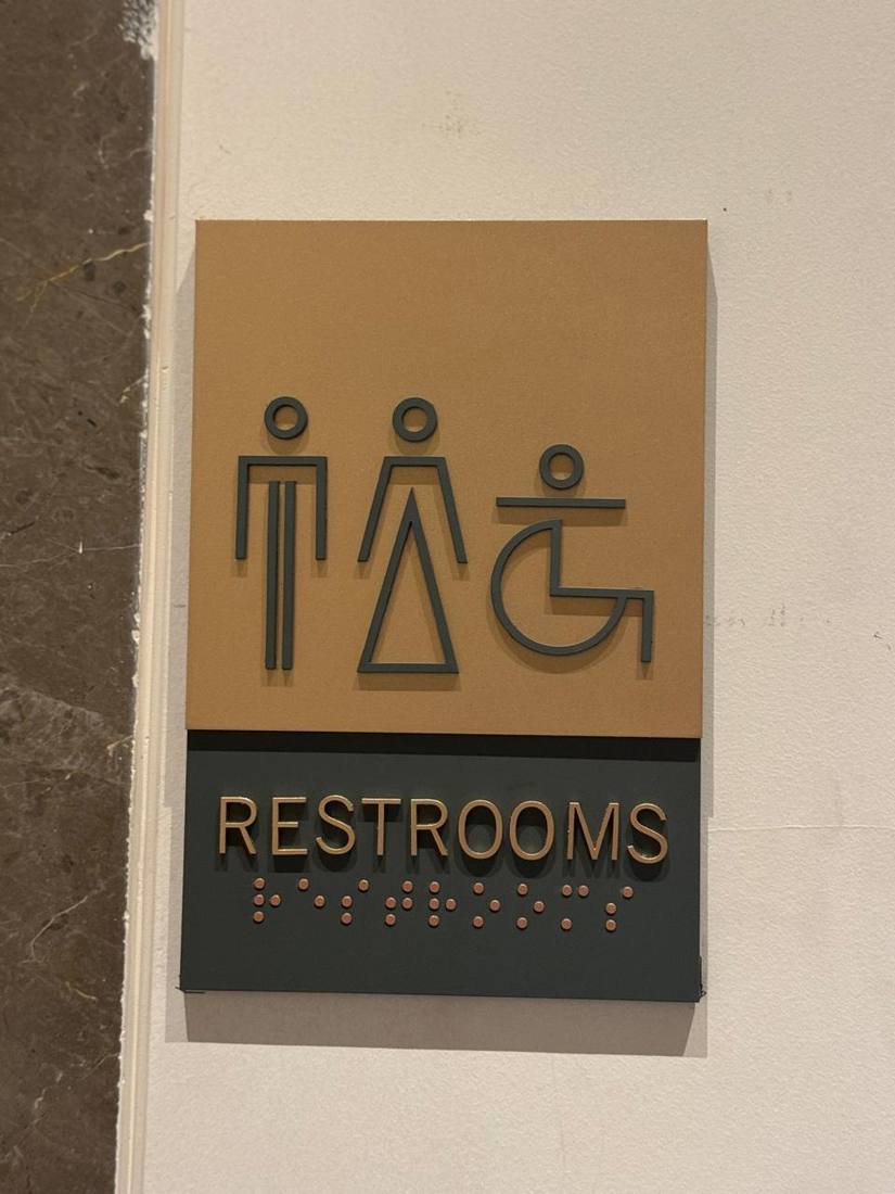 Restroom sign with braille
